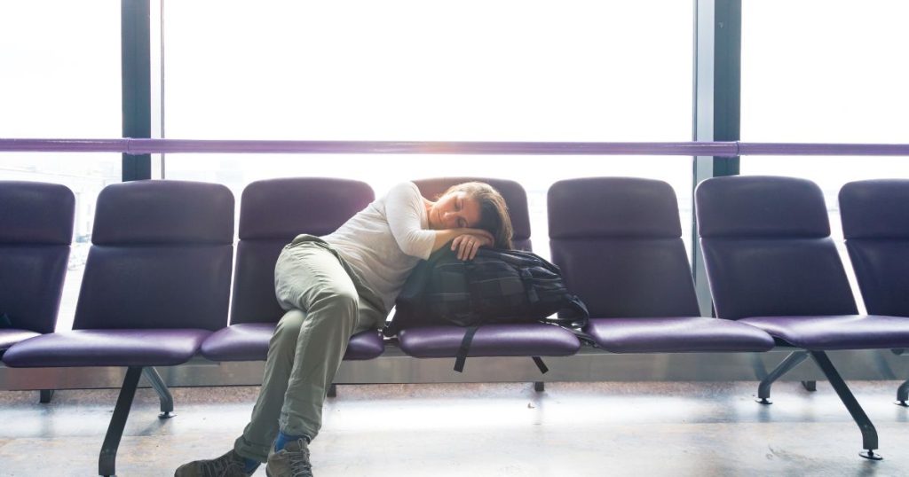 Lady waiting for flight at boarding area